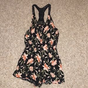 floral romper with lace detail on back